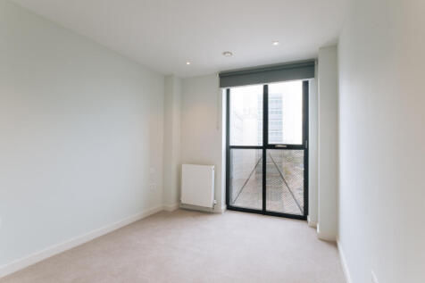Experience modern simplicity with abundant natural light in this chic urban apartment.