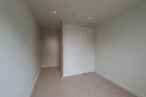 Experience serenity in this minimalist bedroom corner designed for peaceful living.