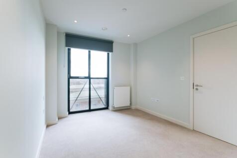 Experience the elegance of minimalist design with this spacious, light-filled room.