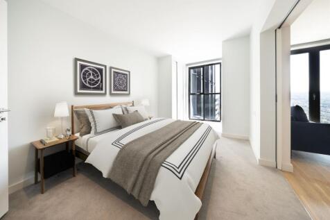 Experience tranquility in this elegantly designed bedroom with a stunning view.