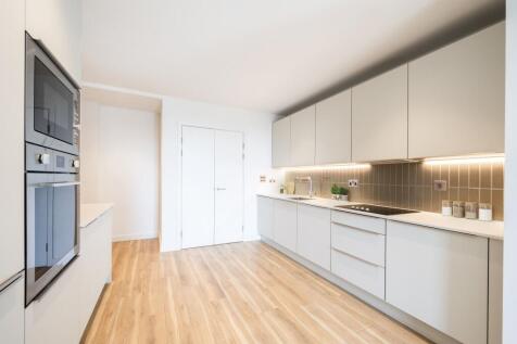 Step into a kitchen where style meets functionality, offering a seamless culinary experience.