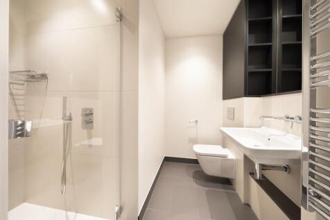 Experience tranquility in this sleek, modern bathroom designed for ultimate relaxation.