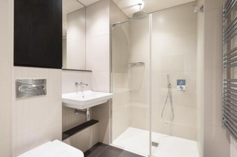 Experience luxury in this sleek modern bathroom, designed for relaxation and style.