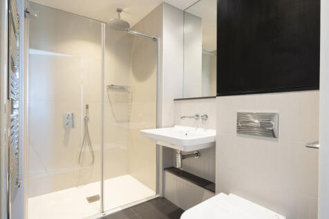 Experience the tranquility of a sleek and stylish bathroom retreat, perfect for relaxation.