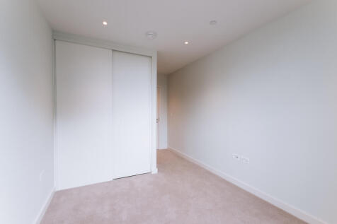 Experience tranquility in this bright and airy minimalist bedroom.