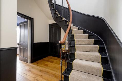 To upper floor