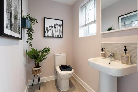 A handy downstairs toilet sits off the entrance hall