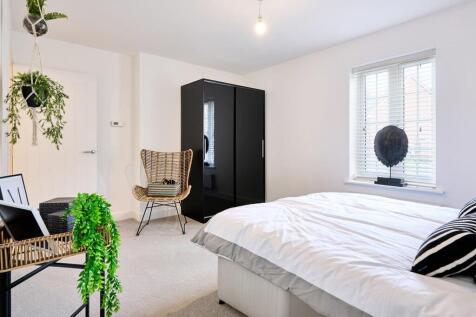 A spacious main bedroom