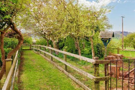 Orchard to the right included