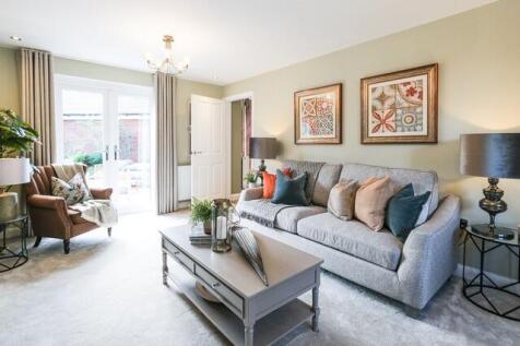 Lounge with French doors to a garden