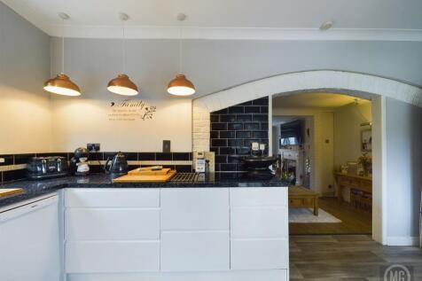 Kitchen leading into Living Area