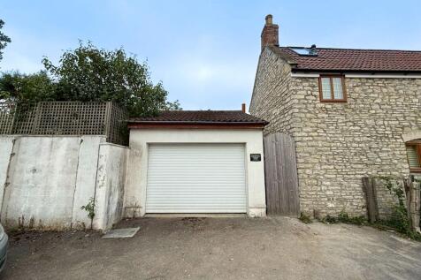 Rear Garage with Electric Roller Door