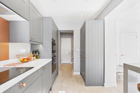 Kitchen leading into Utility