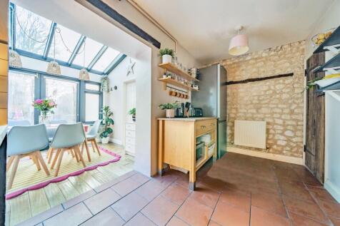 Kitchen leading into Dining room