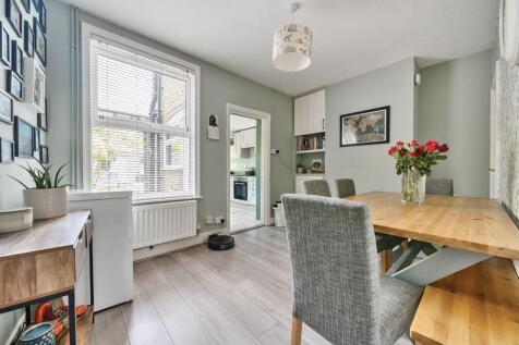 Dining room leading into kitchen