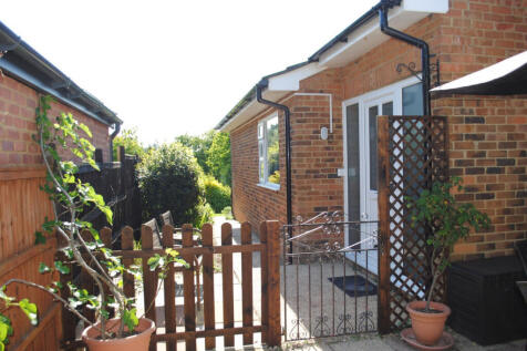 Side of the house, side terrace and front door