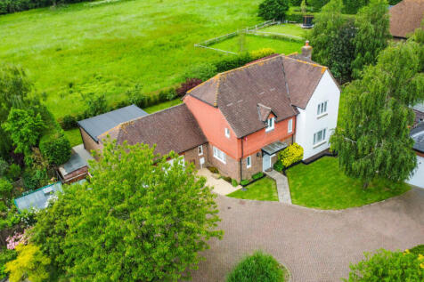 Elevated view of the house with the field behind