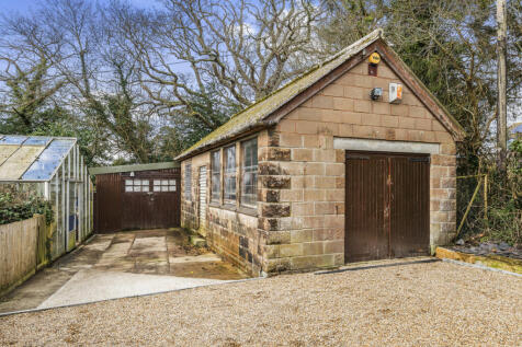 Driveway providing parking for numerous cars and large Garage / workshop / Potential Home Office / Potential Annexe