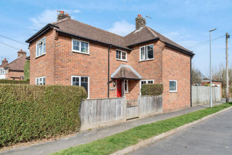 Front and side elevation with front garden and side front door
