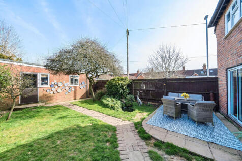 South facing private rear garden with direct access into 19ft x 18ft double garage