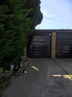 Garage en bloc accessed from rear garden with parking for one vehicle