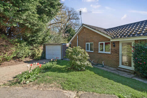 Driveway, Garage and side garden with extension potential to enlarge the kitchen