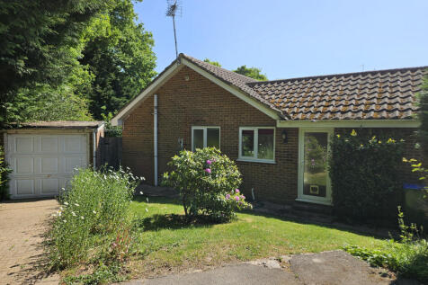 Garage, driveway and side garden