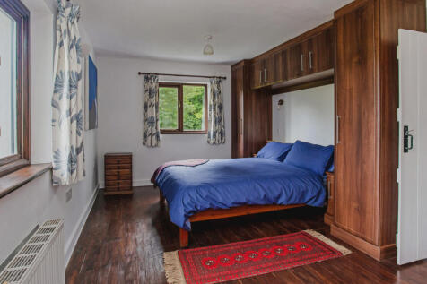 Double aspect Master bedroom with stunning views over open fields and your own privately owned woodland