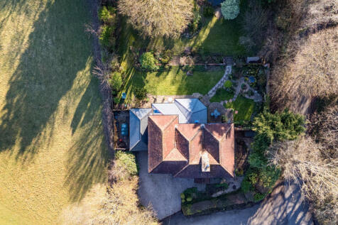 Drone view of house, garden and privately owned woodland