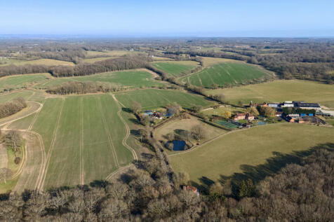 Aerial view of open countryside around the property
