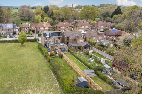 Elevated view of the rear of the house and private 100ft South facing garden