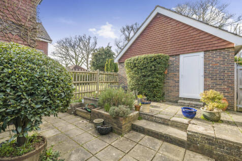 Side terrace which is a sun trap with the West facing afternoon/evening sun