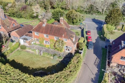 Elevated view of the rear elevation and South facing garden and terrace