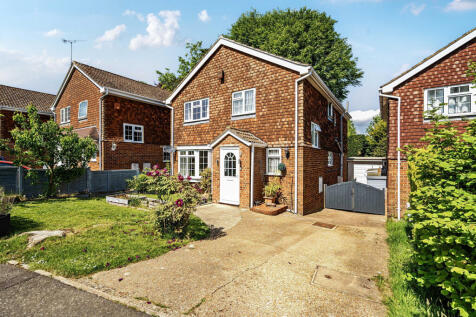 Front elevation, front garden and driveway with parking for two to three vehicles