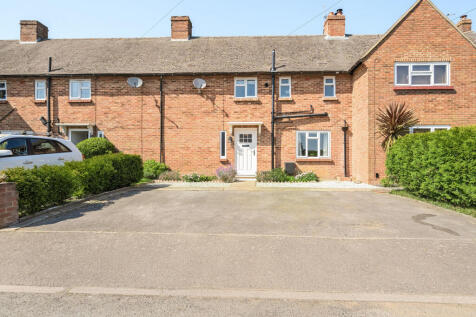 Front elevation and driveway providing off road parking for three vehicles