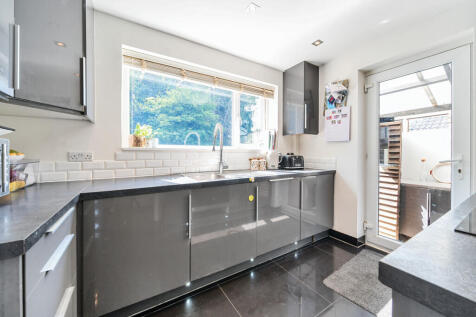 Kitchen with door out to covered utility room