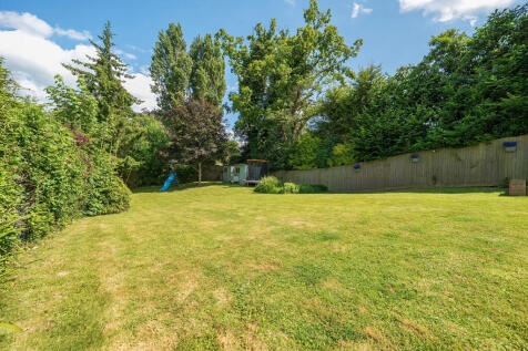 Large private rear garden with views over open woodland and fields