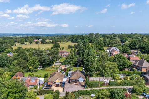 Aerial view of property and the semi rural positioning with public footpaths radiating from Hazeldene Lane itself
