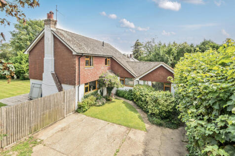 Front elevation, driveway and rear garden
