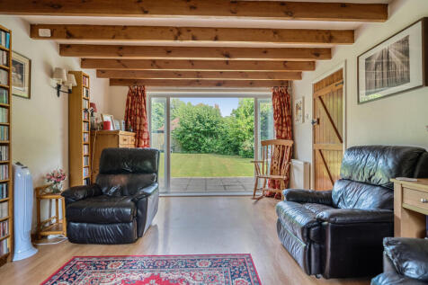 Living room with doors leading directly out onto the private rear garden