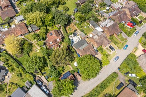 Aerial view of house, plot and detached double garage at the front