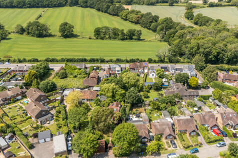 Aerial view of the house and surrounding open countryside