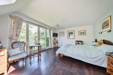 Master bedroom with juliette balcony and private secluded views over the rear garden