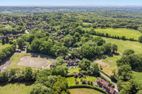 Aerial view of the garden, rear elevation and open countryside all around