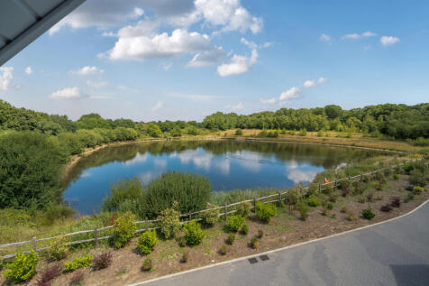 View over lake from all front facing windows and balconies