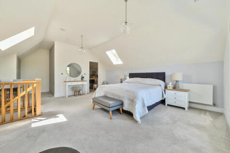 Master Bedroom with vaulted ceiling and dressing area