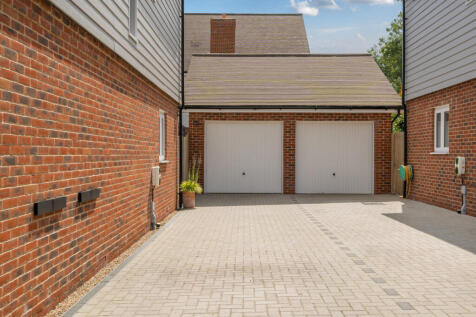 Driveway providing parking for two / three vehicles and garage with power and light
