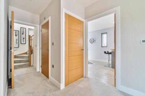 Door providing access to master suite from first floor landing