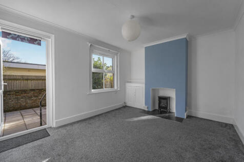 Living room with access onto the rear terrace