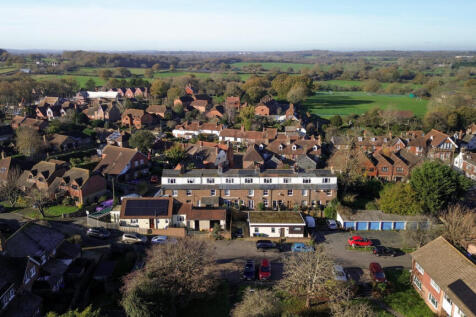 Aerial view over the house and open countryside and walks beyond